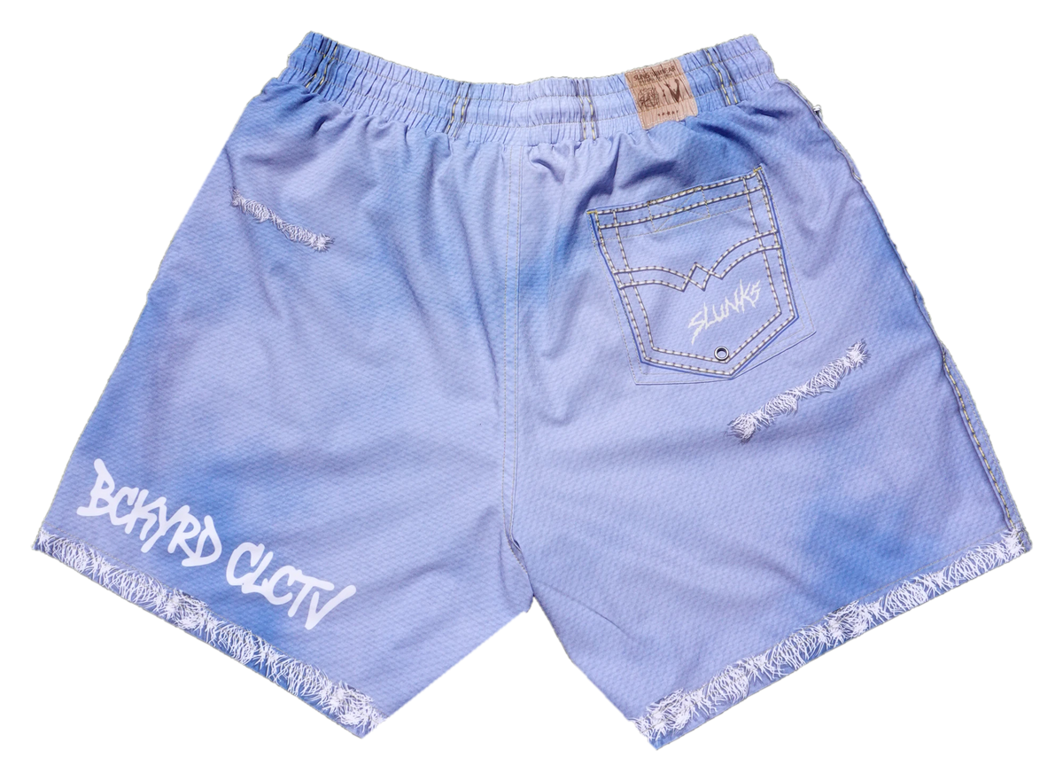 Rear view of JORTS showing the back pocket, waistband patch, distressing, and raw-edge details
