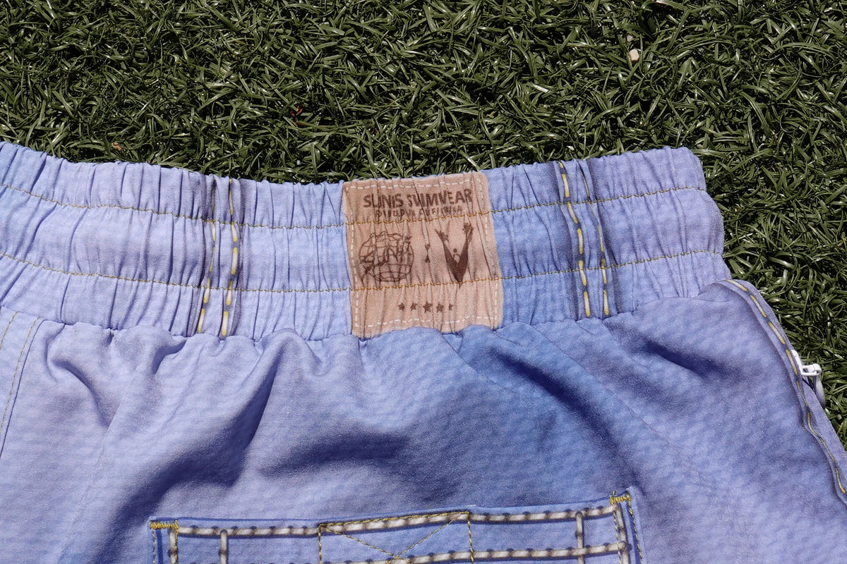 Close-up of the Slunks Swimwear and Volleyball Guys collaboration waistband label