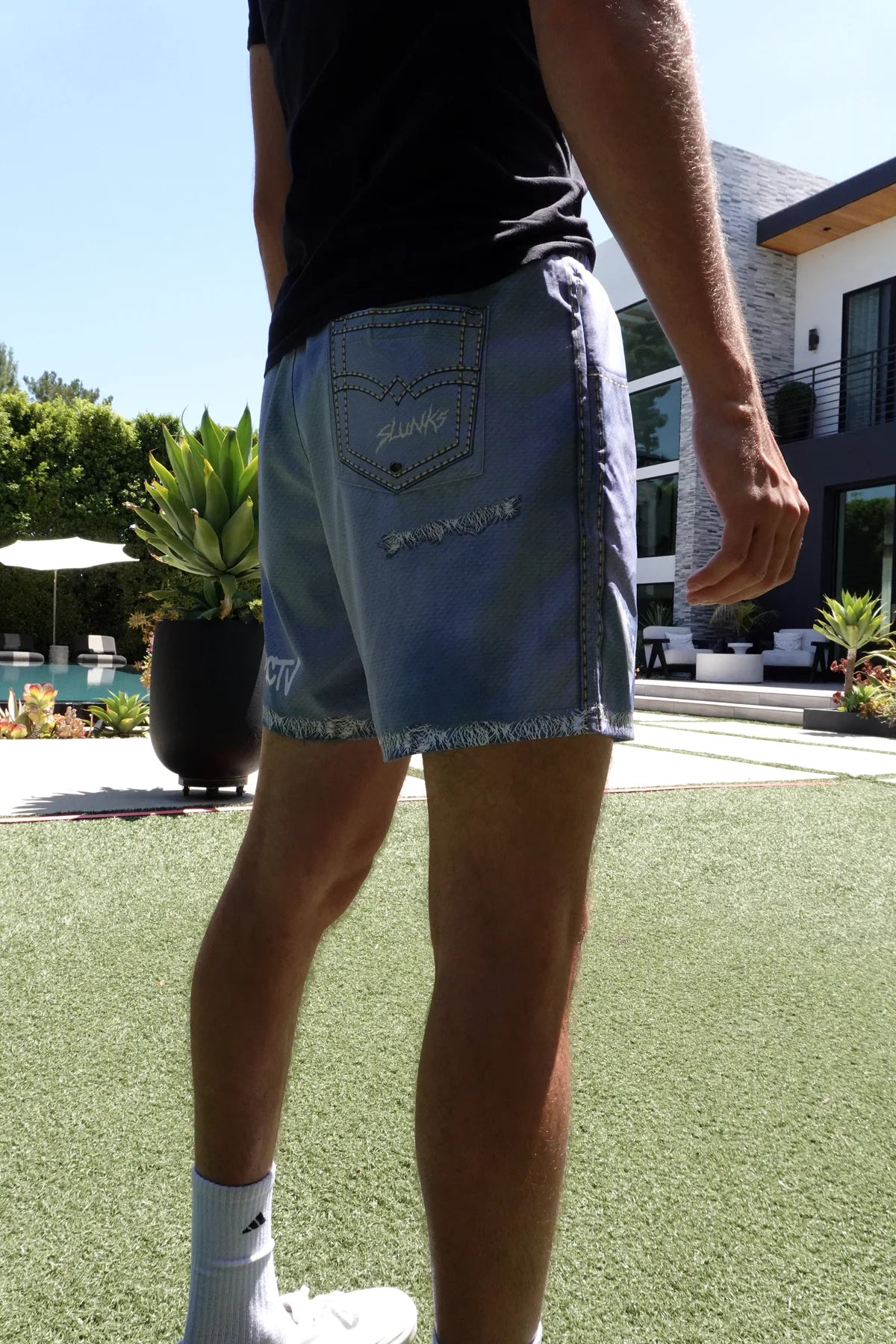 Rear on-body fit of JORTS in a backyard volleyball setting
