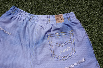 Close-up of the JORTS back pocket stitching and metal eyelet